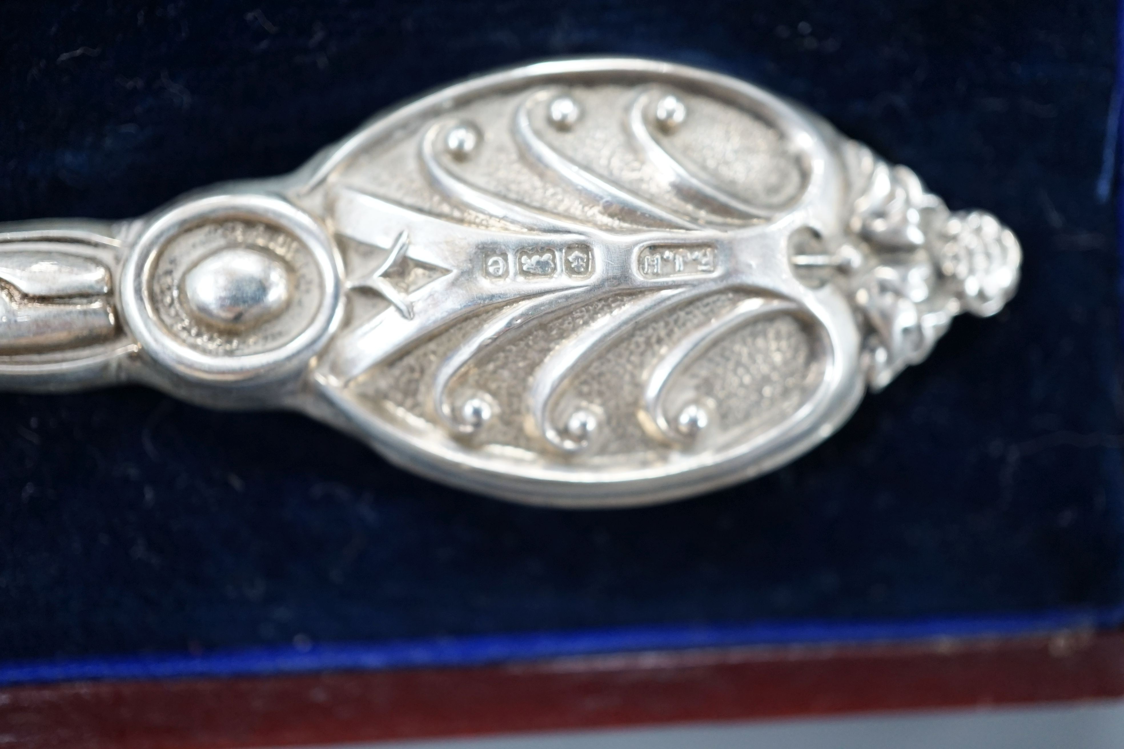 A group of small silver to include two vesta cases, a hand mirror, paste pin and a cased button hook and shoehorn.